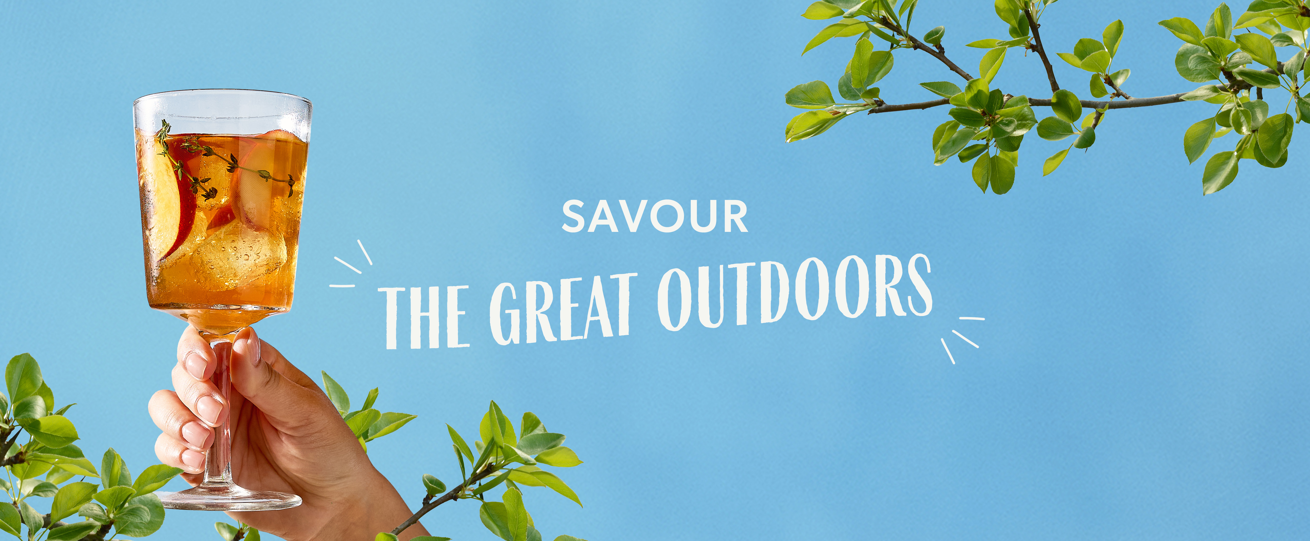 Peach iced tea with text Savour the great outdoors