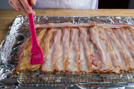 5. Brush bacon with syrup